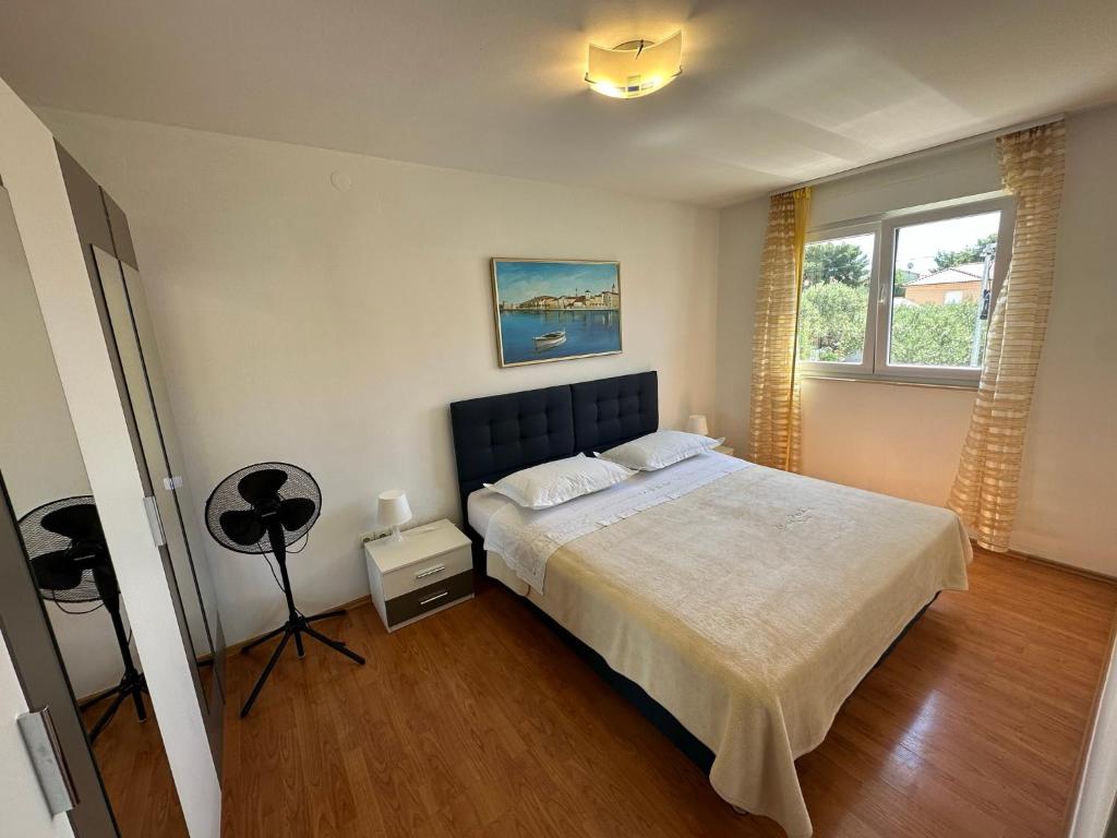 Postel nebo postele na pokoji v ubytování Apartment Mika 3