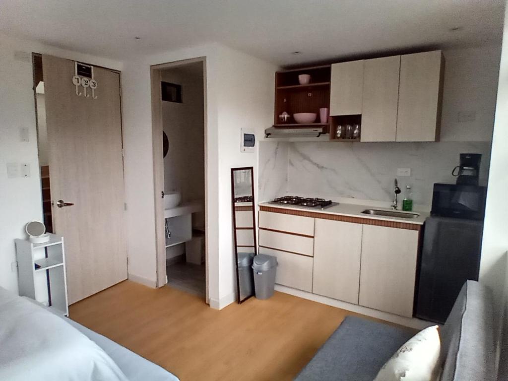 Η κουζίνα ή μικρή κουζίνα στο Homy Apartamentos - Deluxe