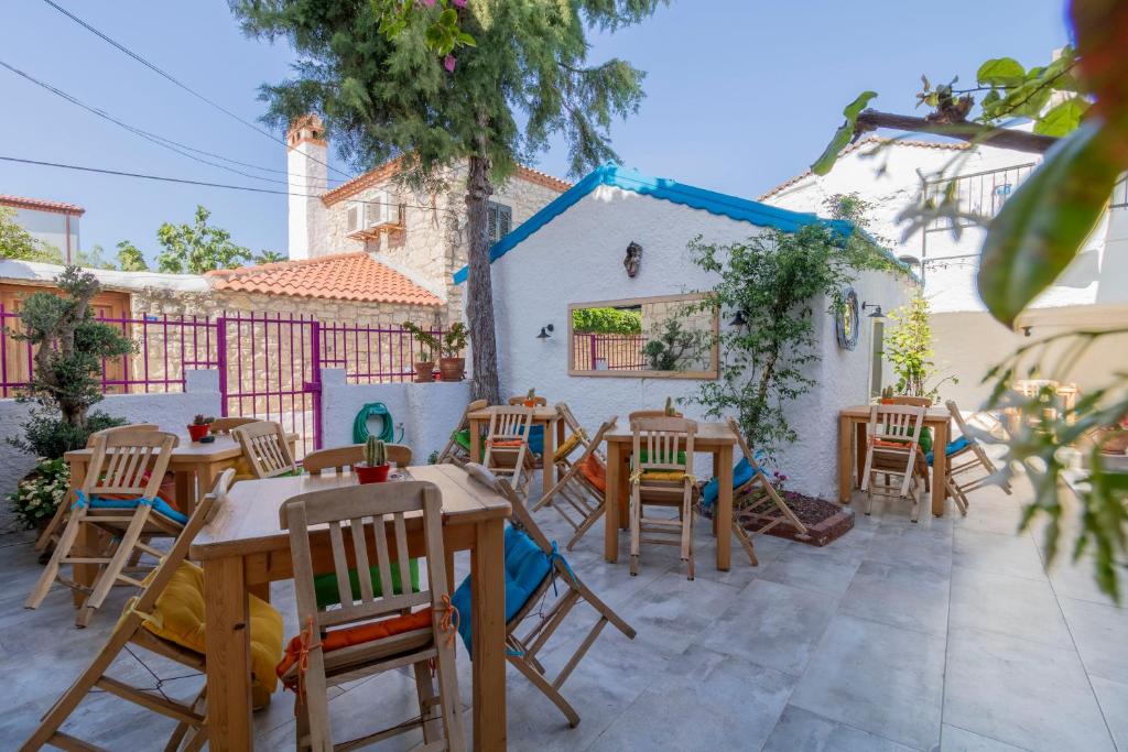 a group of tables and chairs on a patio at Das Hotel Alacati in Alaçatı