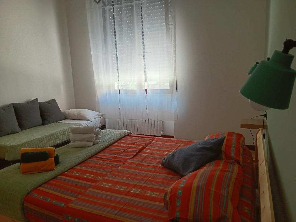 Postel nebo postele na pokoji v ubytování LaelleApartament Rho Fiera San Siro