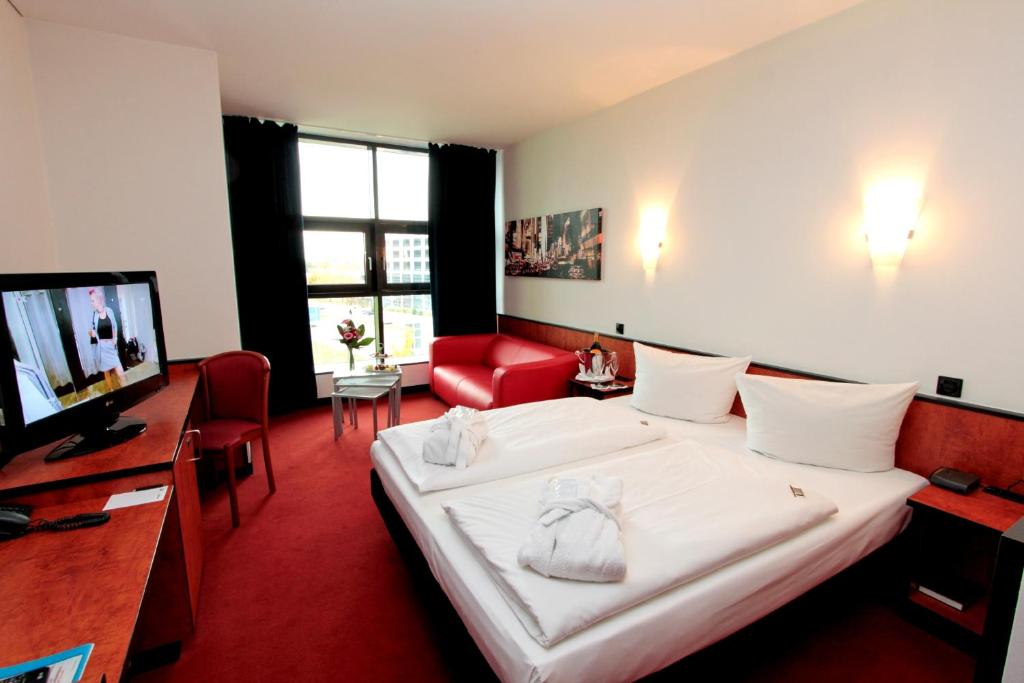 TV a/nebo společenská místnost v ubytování Ara Hotel Comfort