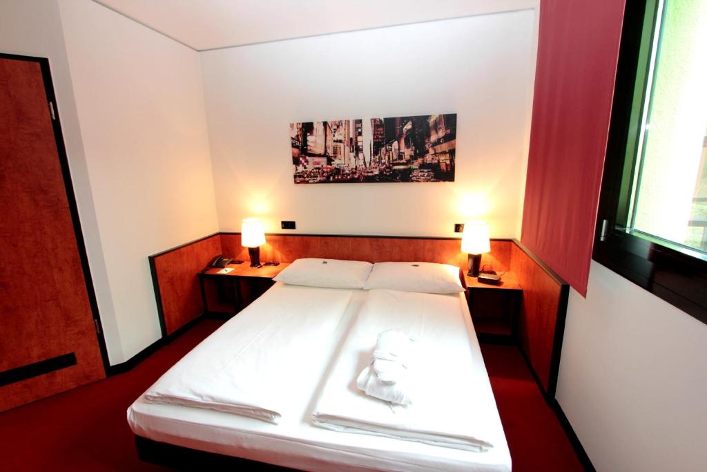 Postel nebo postele na pokoji v ubytování Ara Hotel Comfort