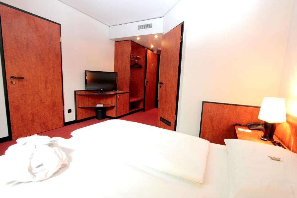 Postel nebo postele na pokoji v ubytování Ara Hotel Comfort