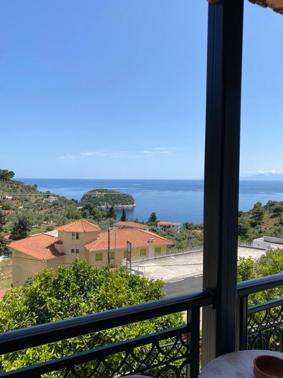 a view of the ocean from a balcony at Betsanis Stafylos Apartments in Stafylos