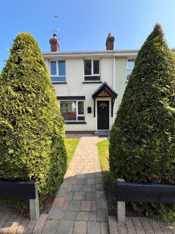 two large hedges in front of a house at Corrigs Retreat in Newcastle
