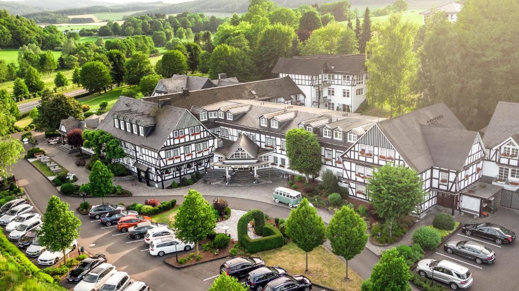 an aerial view of a large house with a parking lot at Romantikhotel Platte in Attendorn
