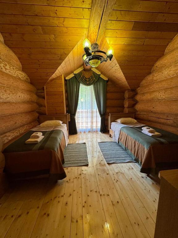Postel nebo postele na pokoji v ubytování Molfar Resort Hotel & SPA Карпати