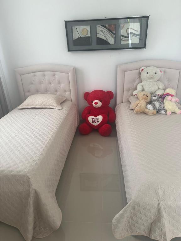Un pat sau paturi într-o cameră la DSVilla