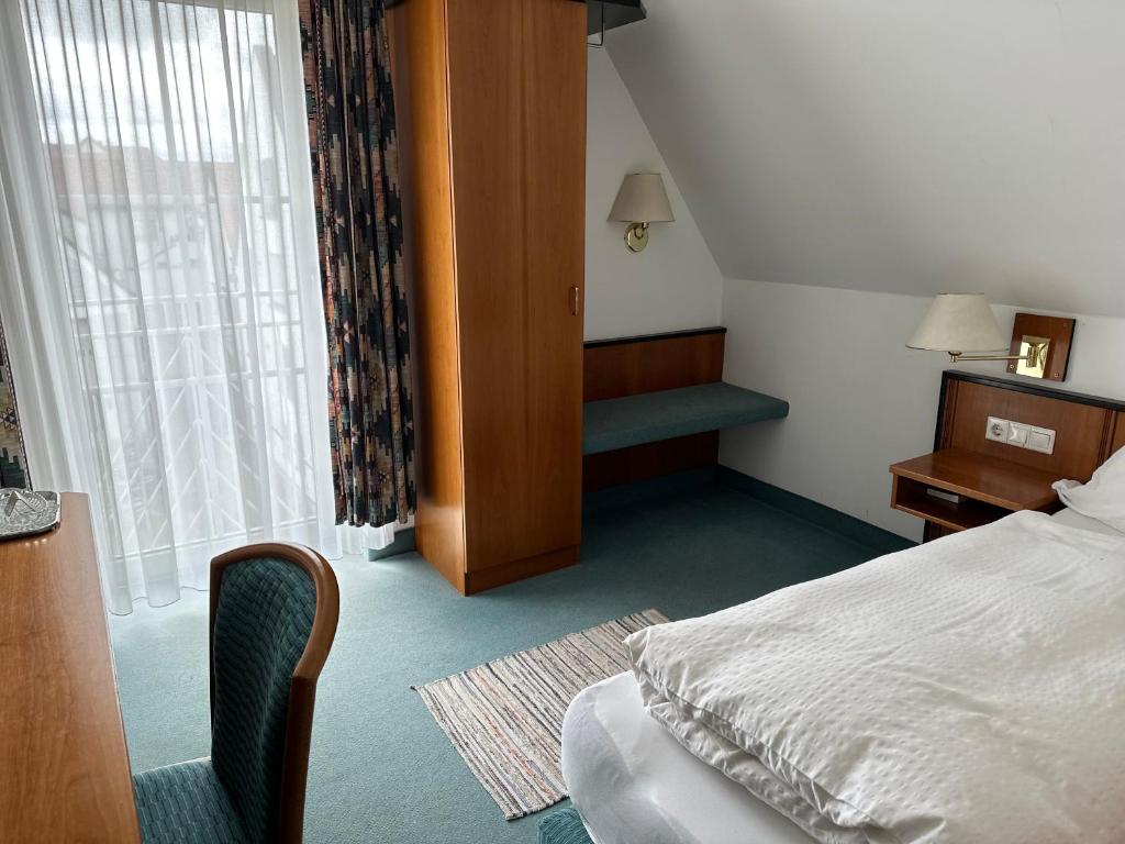 Postel nebo postele na pokoji v ubytování ST Hotel
