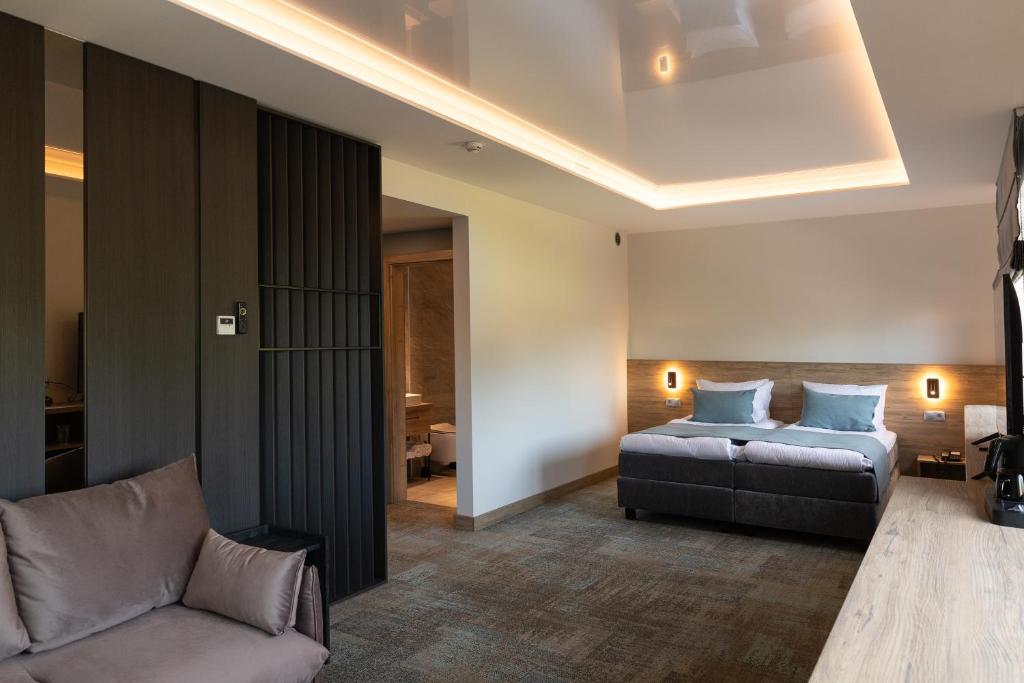 Säng eller sängar i ett rum på Molėtai Hotel