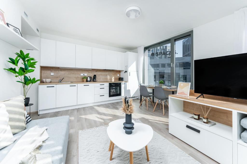Kuchyň nebo kuchyňský kout v ubytování MyMozart Apartments Prague by Rentero Property