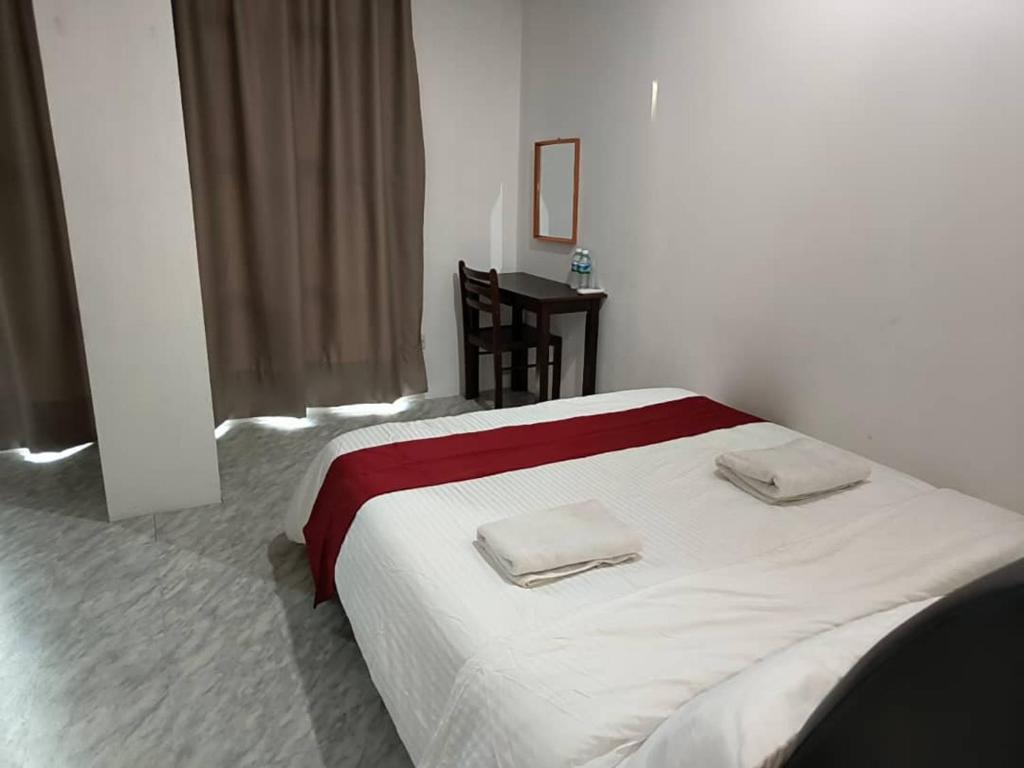 Postel nebo postele na pokoji v ubytování NaVita Lodge