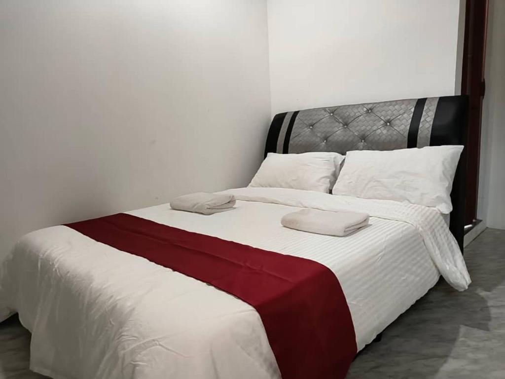 Postel nebo postele na pokoji v ubytování NaVita Lodge