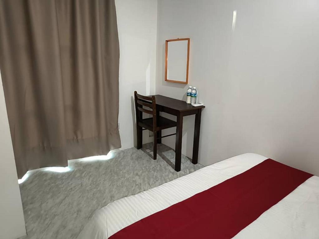 Postel nebo postele na pokoji v ubytování NaVita Lodge