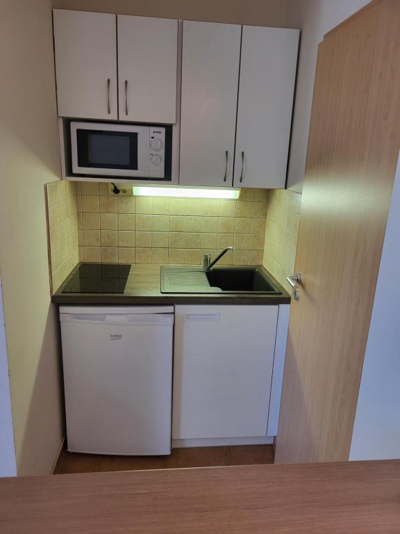 Kuchyňa alebo kuchynka v ubytovaní Tip-Top Apartmenthouse