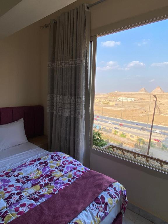 Postel nebo postele na pokoji v ubytování Pyramita Hotel