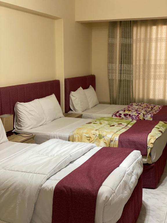 Postel nebo postele na pokoji v ubytování Pyramita Hotel