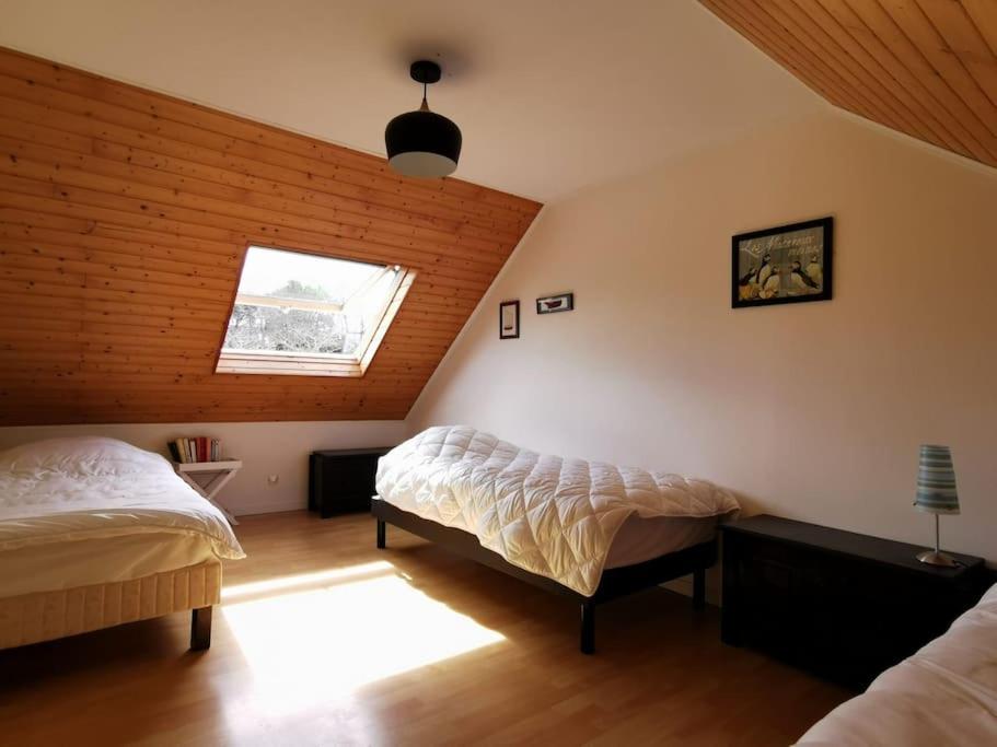 Postel nebo postele na pokoji v ubytování Maison Vue Mer, entre port et plage Port Manech