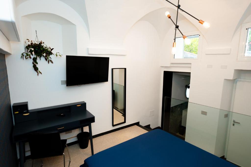 TV a/nebo společenská místnost v ubytování Secret Suite Varigotti