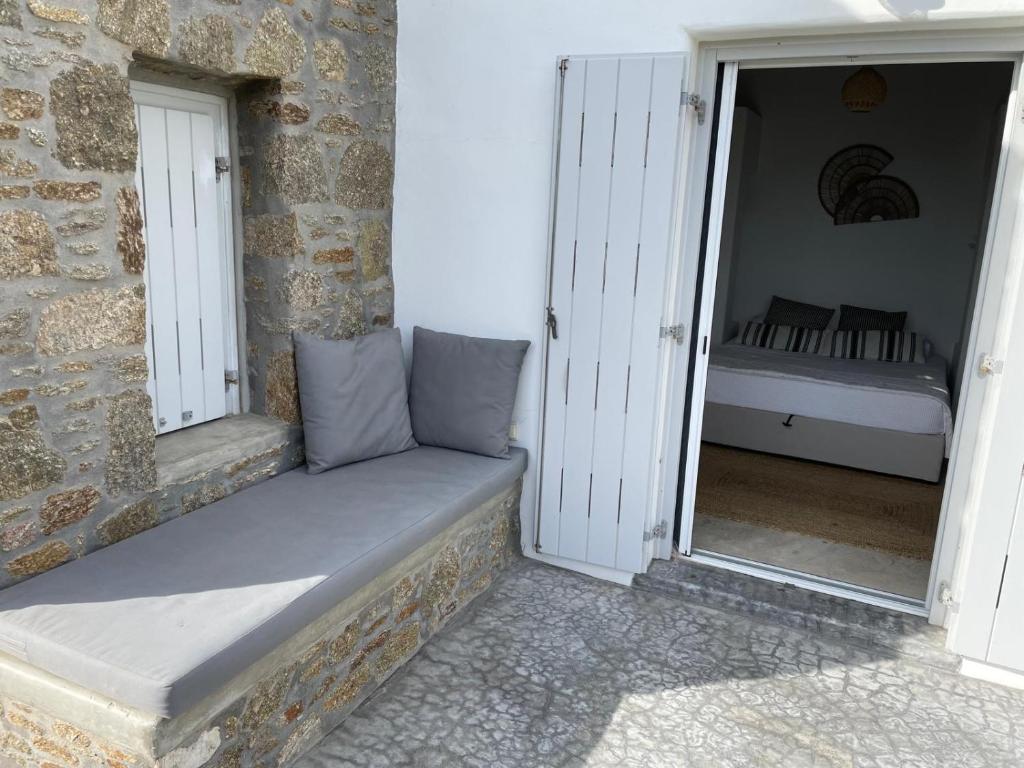 Postel nebo postele na pokoji v ubytování Kato Spiti, an idyllic retreat, Mykonos