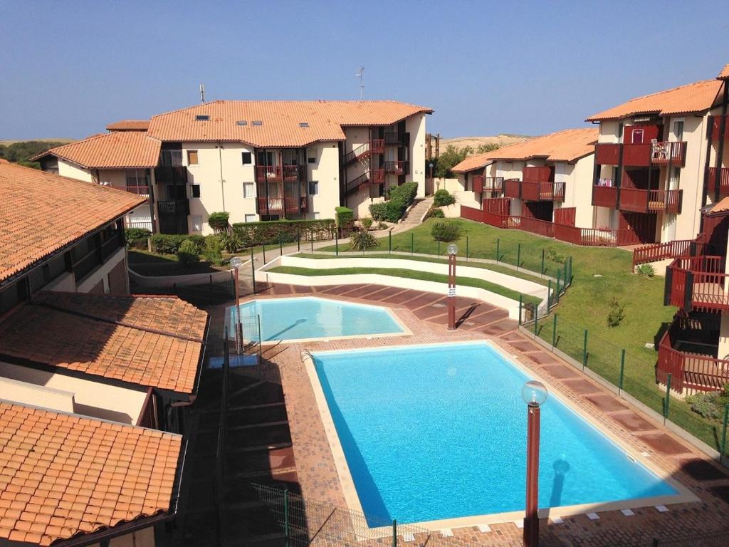 Πισίνα στο ή κοντά στο V-Landes 04-Vieux Boucau Appartement 4 personnes dans résidence avec piscine au bord du lac marin