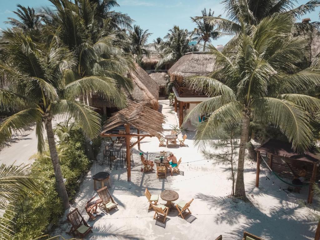 an aerial view of a resort with palm trees at Casa Iguana Holbox - Beachfront Hotel in Holbox Island
