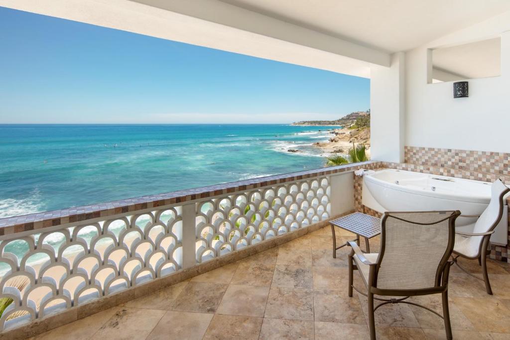 a bathroom with a view of the ocean at Cabo Surf Hotel in San José del Cabo