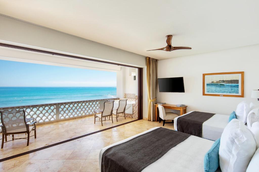 a hotel room with a view of the ocean at Cabo Surf Hotel in San José del Cabo