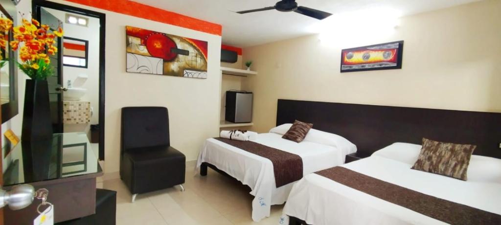 Postel nebo postele na pokoji v ubytování Hotel San Miguel