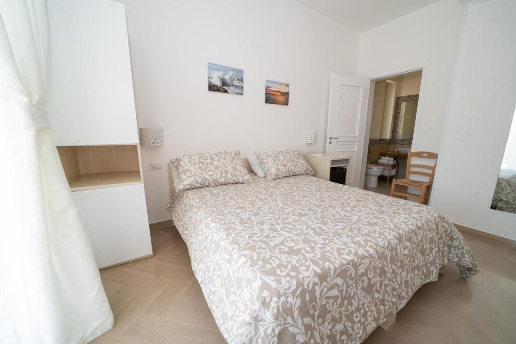 Łóżko lub łóżka w pokoju w obiekcie Villa Cristina B&b Alezio