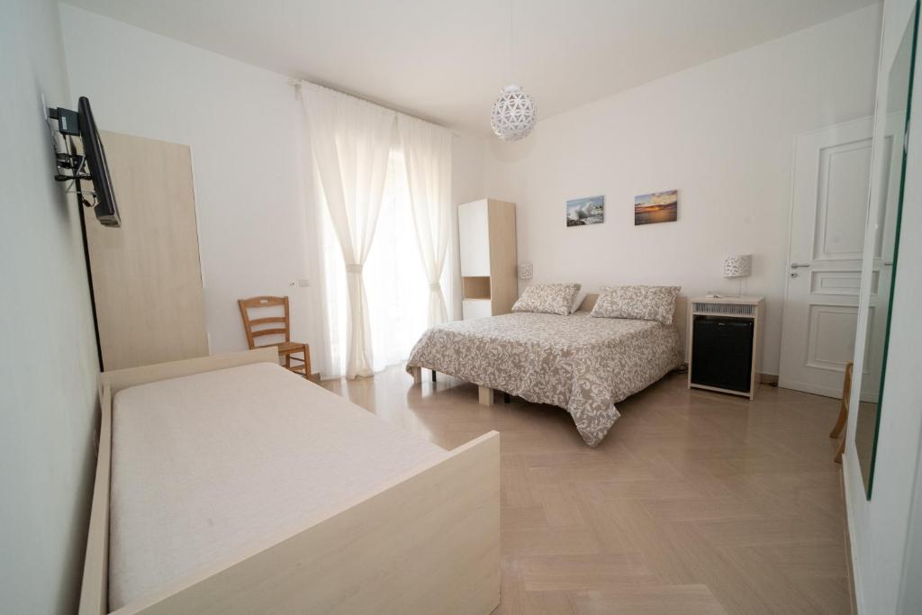 Łóżko lub łóżka w pokoju w obiekcie Villa Cristina B&b Alezio