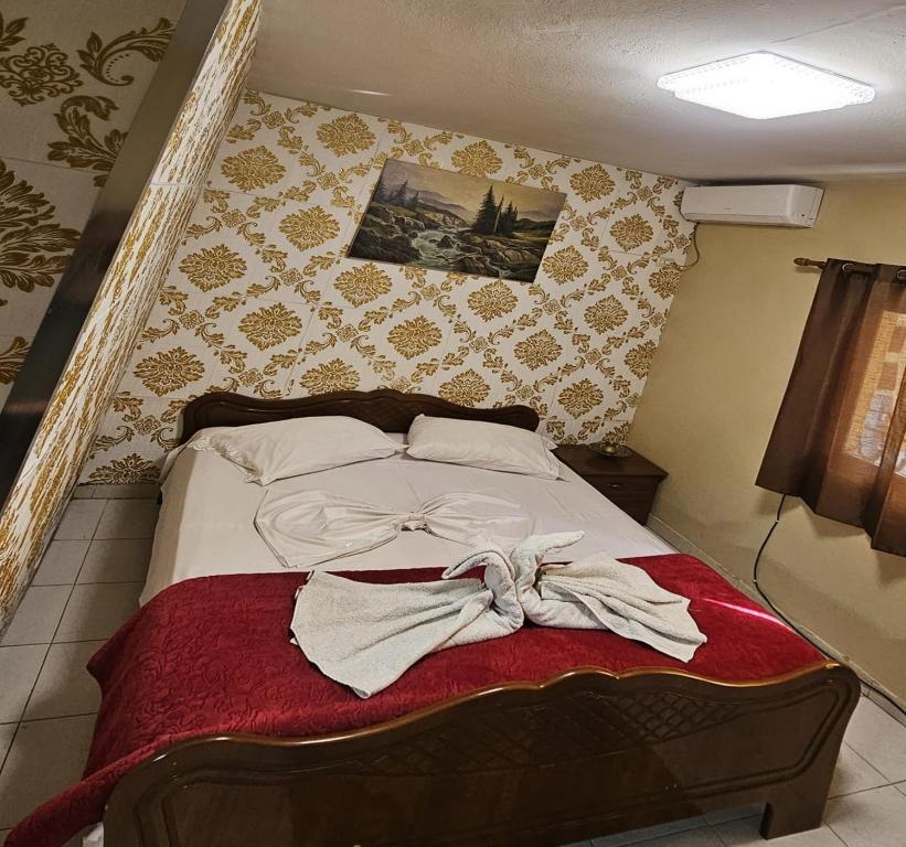 Postel nebo postele na pokoji v ubytování Dafina Hotel