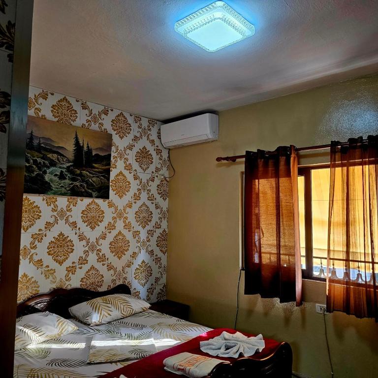 Postel nebo postele na pokoji v ubytování Dafina Hotel