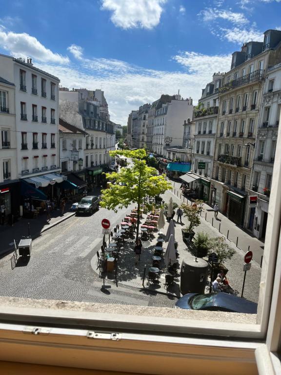a view from a window of a city street at Deux chambres en plein cœur de Montmartre, Paris in Paris