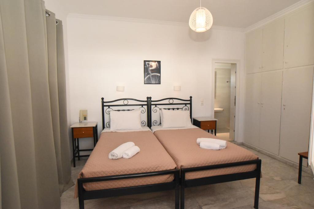 Postel nebo postele na pokoji v ubytování Asteri Hotel