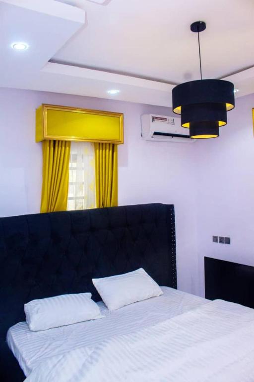 Postel nebo postele na pokoji v ubytování A and T apartment