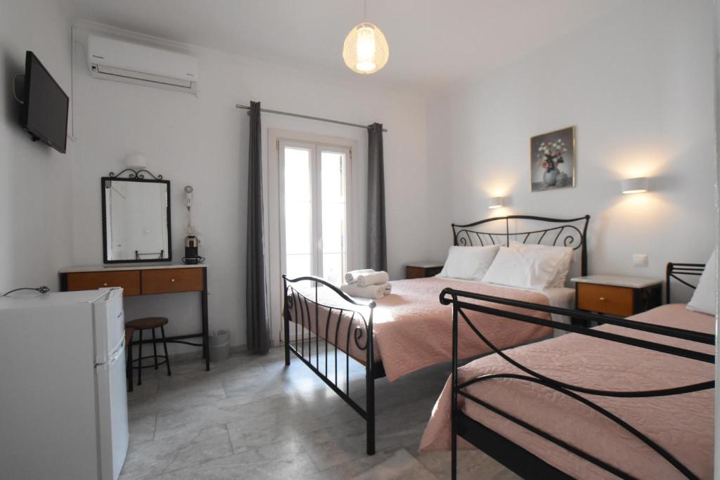 Postel nebo postele na pokoji v ubytování Asteri Hotel
