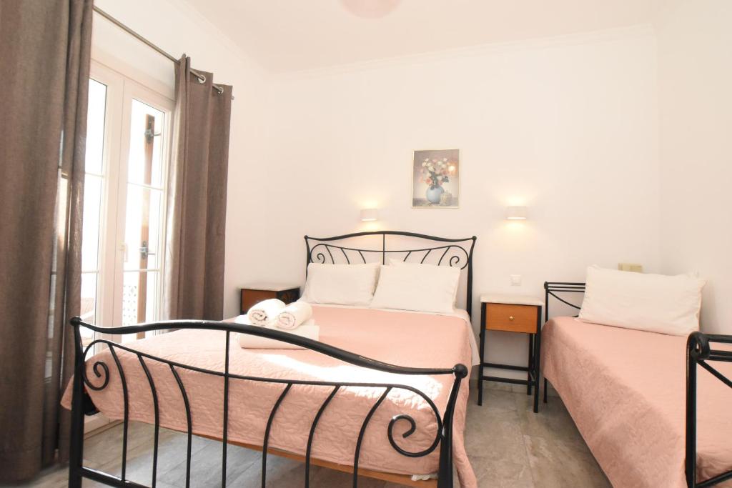Postel nebo postele na pokoji v ubytování Asteri Hotel