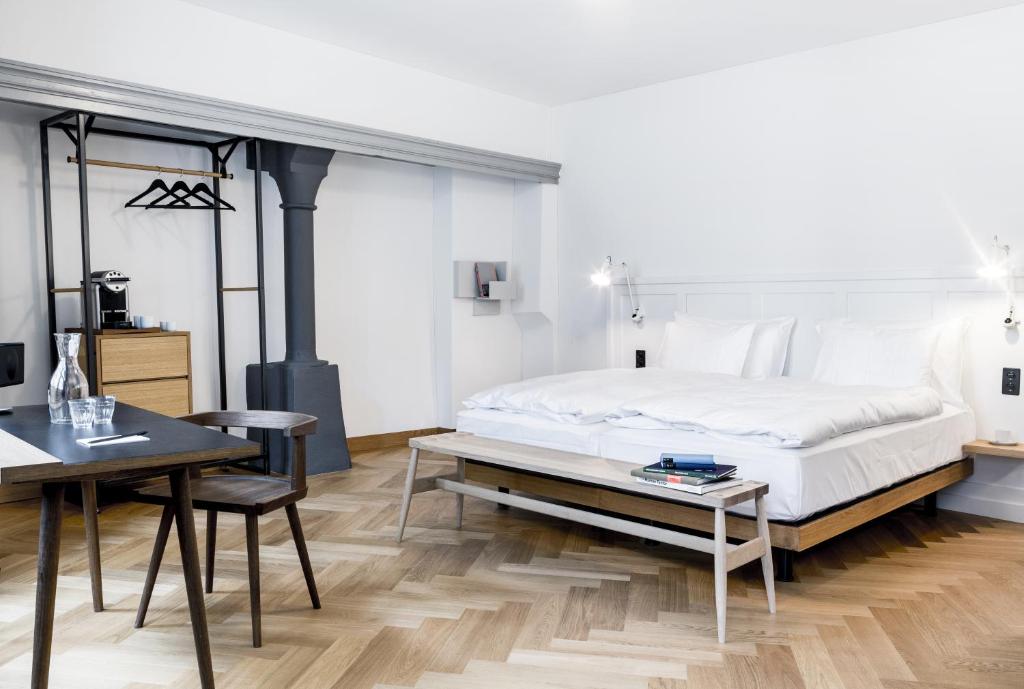 Postel nebo postele na pokoji v ubytování Marktgasse Hotel