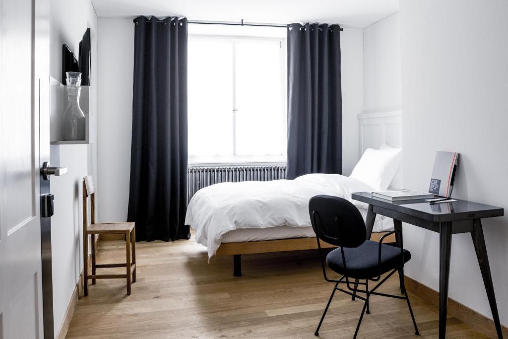 Postel nebo postele na pokoji v ubytování Marktgasse Hotel