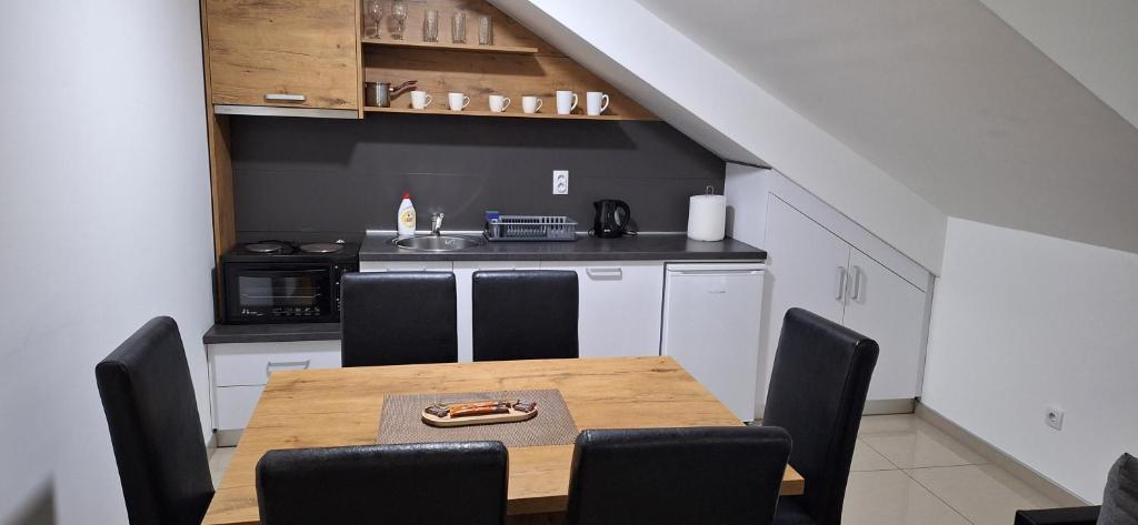 Kuchyň nebo kuchyňský kout v ubytování S-Apartmani Cocetova