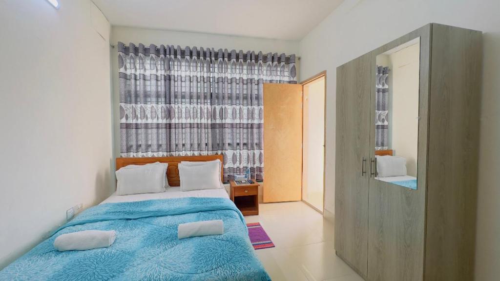 Postel nebo postele na pokoji v ubytování Hotel Stay Inn Uttara
