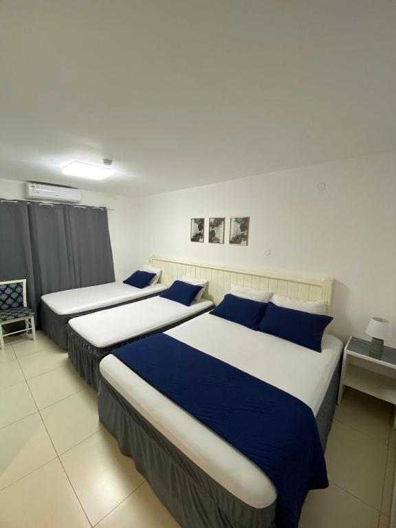Postel nebo postele na pokoji v ubytování Hotel Renty Beach