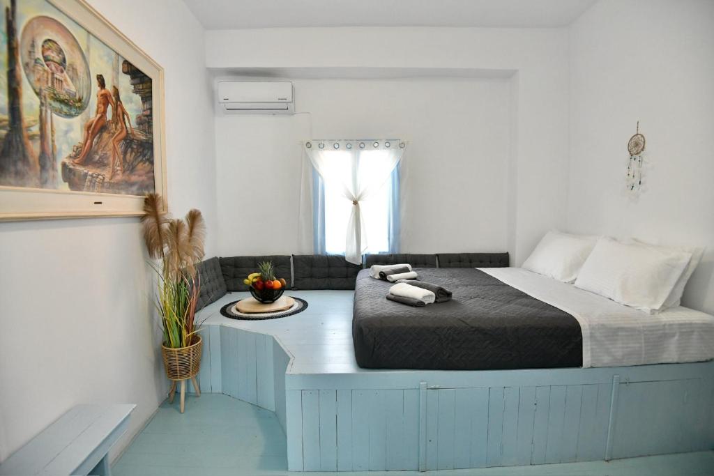 a bedroom with a large bed and a window at Katia’s Home in Rhodes Town