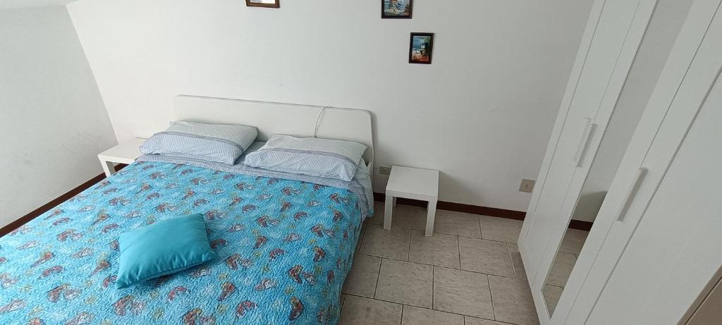 A bed or beds in a room at Bibione villa Torino via della bilancia 43