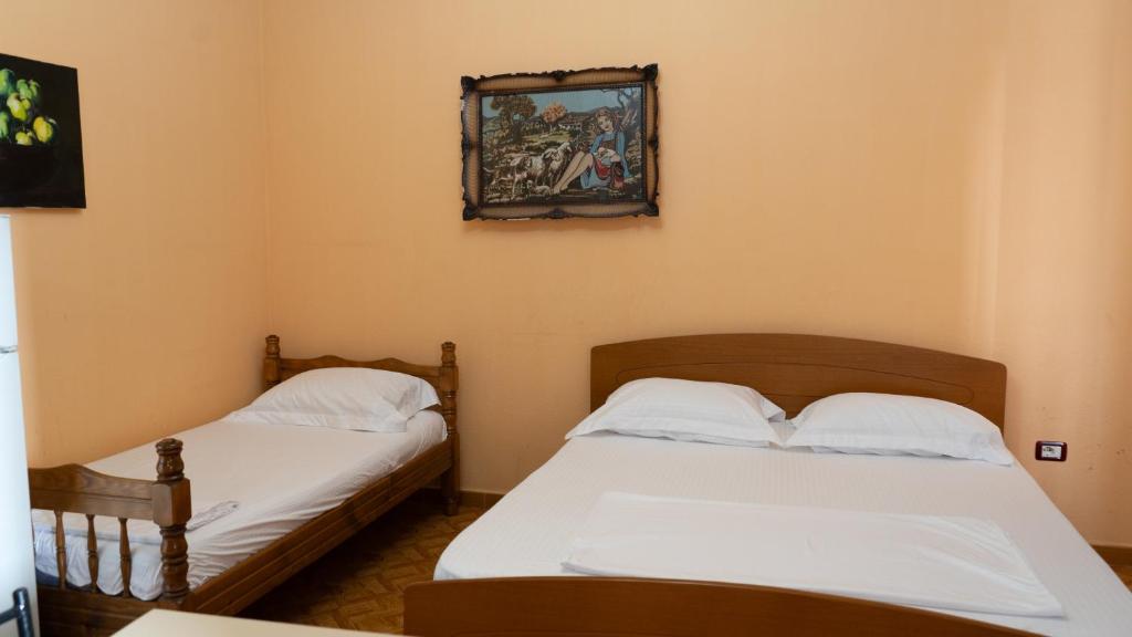 Postel nebo postele na pokoji v ubytování Villa Osmani