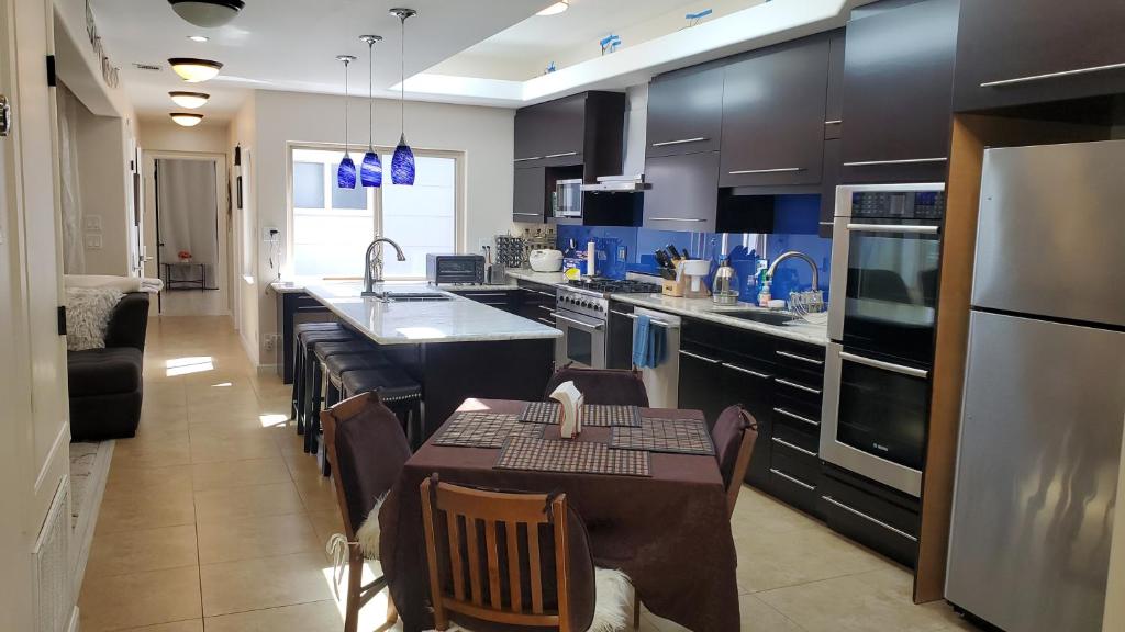 a kitchen with a table and chairs in a kitchen at Beautiful Home 4 Bd. 2 Ba. SF. in San Francisco