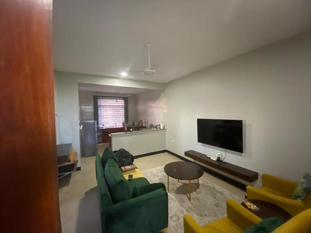 TV a/nebo společenská místnost v ubytování maasaifari Cozy 2