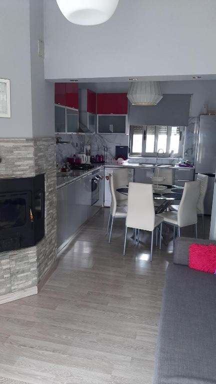 a kitchen with a table and chairs in a kitchen at Isaias house in Rhodes Town