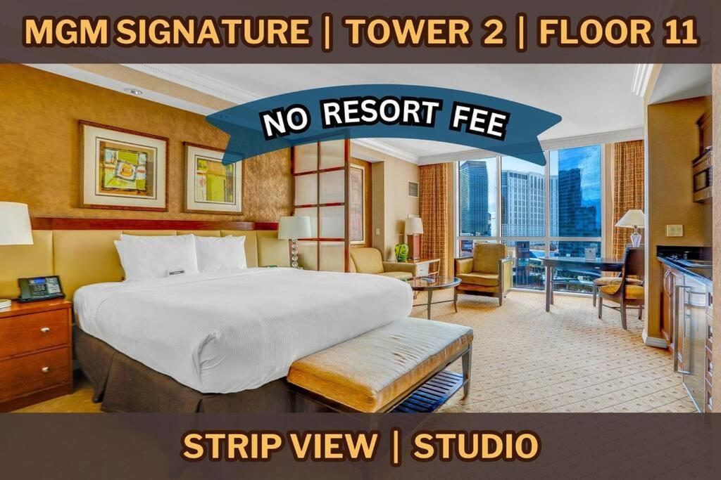 Hotel 11th Floor MGM Signature Studio:Strip View, No Fee, a hotel room with a large bed and a desk at 11th Floor MGM Signature Studio:Strip View, No Fee in Las Vegas